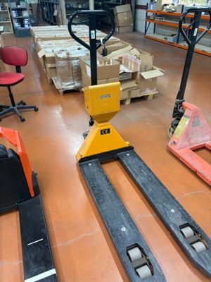 a forklift in the middle of a warehouse floor