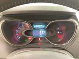 a dashboard of a car with a digital clock on it