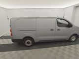 a picture of a silver van in a garage