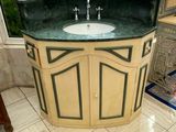 a bathroom with a sink and a window in it