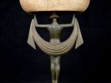 an image of a statue of a woman holding a bowl on top of her head