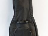 the guitar case is black and has a zipper on the back