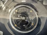 a close up of a clock on the side of a car