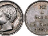 a close up of a coin with a woman ' s face on it