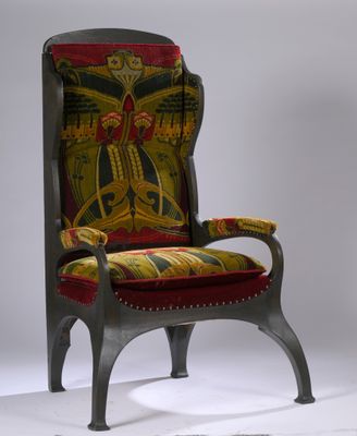 une image représentant une chaise dotée d'une assise rembourrée aux couleurs vives et d'un repose-pieds