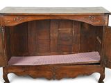 a wooden cabinet with two doors open and a bench underneath it