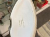 a person holding a white shoe in their hand
