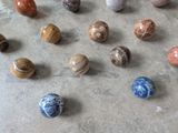 a lot of marbles that are on the floor