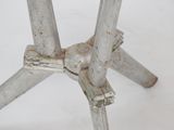 a metal table with a white top and a metal base