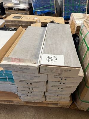 several boxes of electronic equipment sitting on top of a pallet in a warehouse