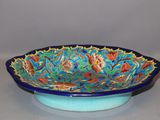 a blue bowl with a floral design on it