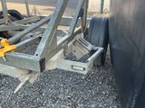 a trailer that has a trailer attached to the side of it