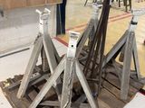 several pieces of metal are sitting on a pallet in a room