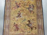 a yellow and blue rug with a picture of people riding horses