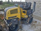 a small yellow machine that is sitting on the ground