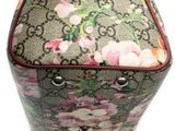 a close up of a purse with flowers on it