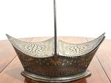 an image of a metal umbrella on top of a wooden table