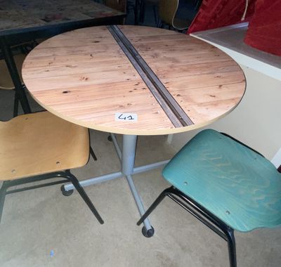 a table with two chairs and a table with a table top on it