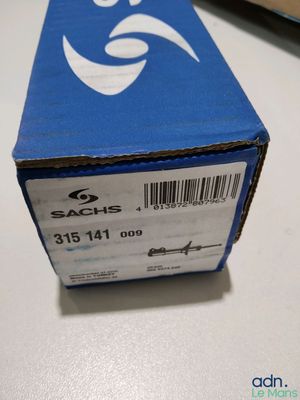 a blue box with a sticker on it sitting on a table