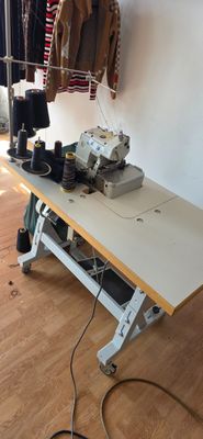 a sewing machine sitting on a table in a room