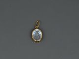 a gold plated pendant with a rainbow moons stone in the center