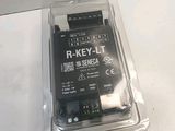 a plastic box with a small electronic device inside of it