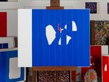 a blue sign with a heart on it in front of a bunch of other signs