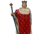 figurine of a statue of a king with a crown and a sword