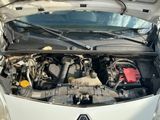 the engine of a car with its hood open and the hood open