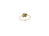 a close up of a gold ring with a flower on it