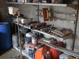 a garage with a lot of tools on the shelves