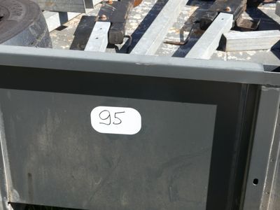 a tv that is sitting in the middle of a pile of junk