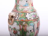 a vase that has been decorated with flowers and birds