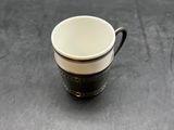 a coffee cup that is sitting on a table