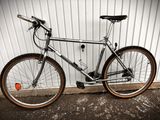 a bike that is parked against a wall