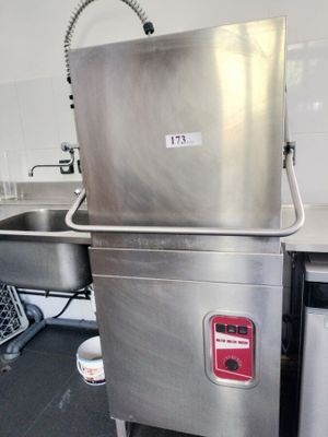 a stainless steel sink in a kitchen next to a dishwasher