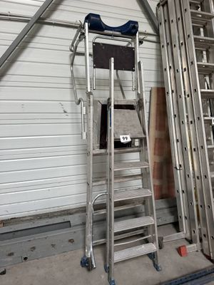 a ladder that is leaning against a wall in a garage