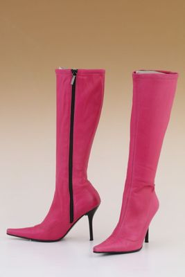 pair of pink high heeled boots on a white background
