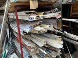 a large pile of metal and wood in a garage