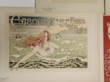 many posters on the wall of a room
