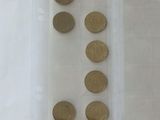 a lot of coins in a plastic bag on the table