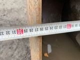 a close up of a measuring tape on a piece of wood