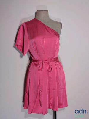 a picture of a pink dress on a mannequin stand