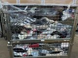 a metal cart with many items in it in a warehouse