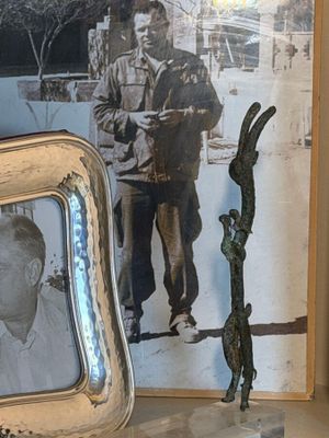 a picture of a man standing next to a picture of a dog
