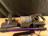 a vacuum that is sitting on a table next to other items