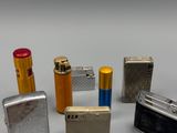 several different types of lighters and lighter lighters are lined up on a table