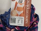 a picture of a woman ' s bra with a tag attached to it
