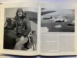 an open book with a black and white photo of a woman in a pilot ' s uniform