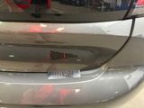 a close up of a car ' s bumper with a sticker on it